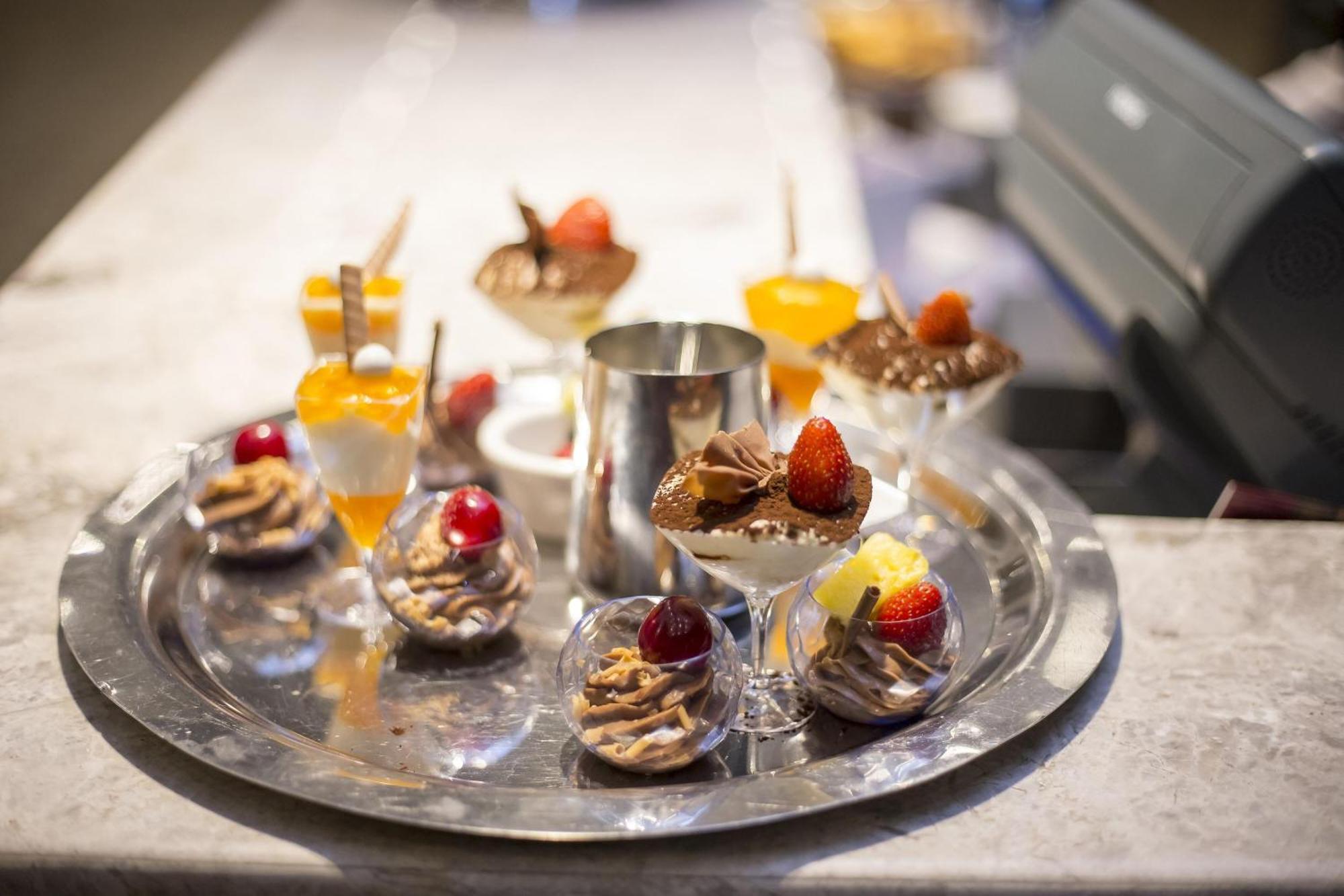 Sheraton Batumi Hotel Exterior photo A selection of desserts