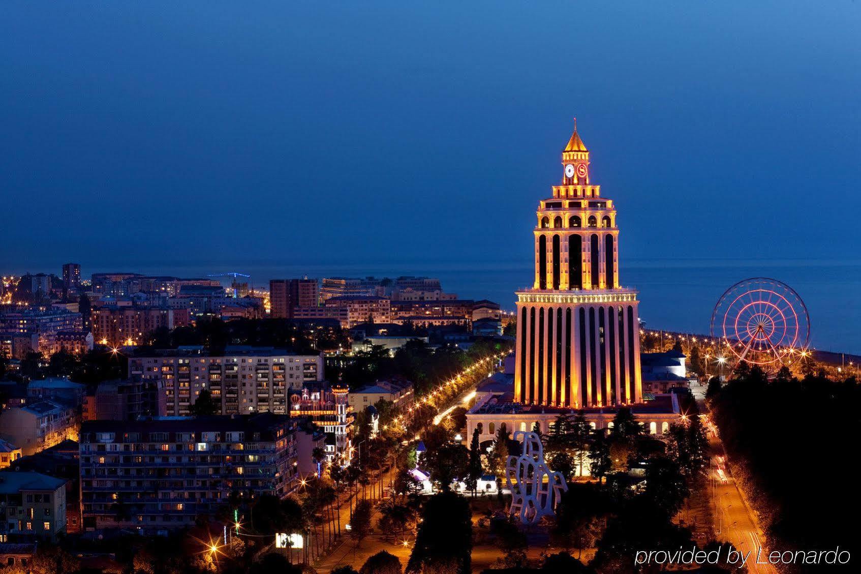 Sheraton Batumi Hotel Exterior photo The Millennium Tower at night